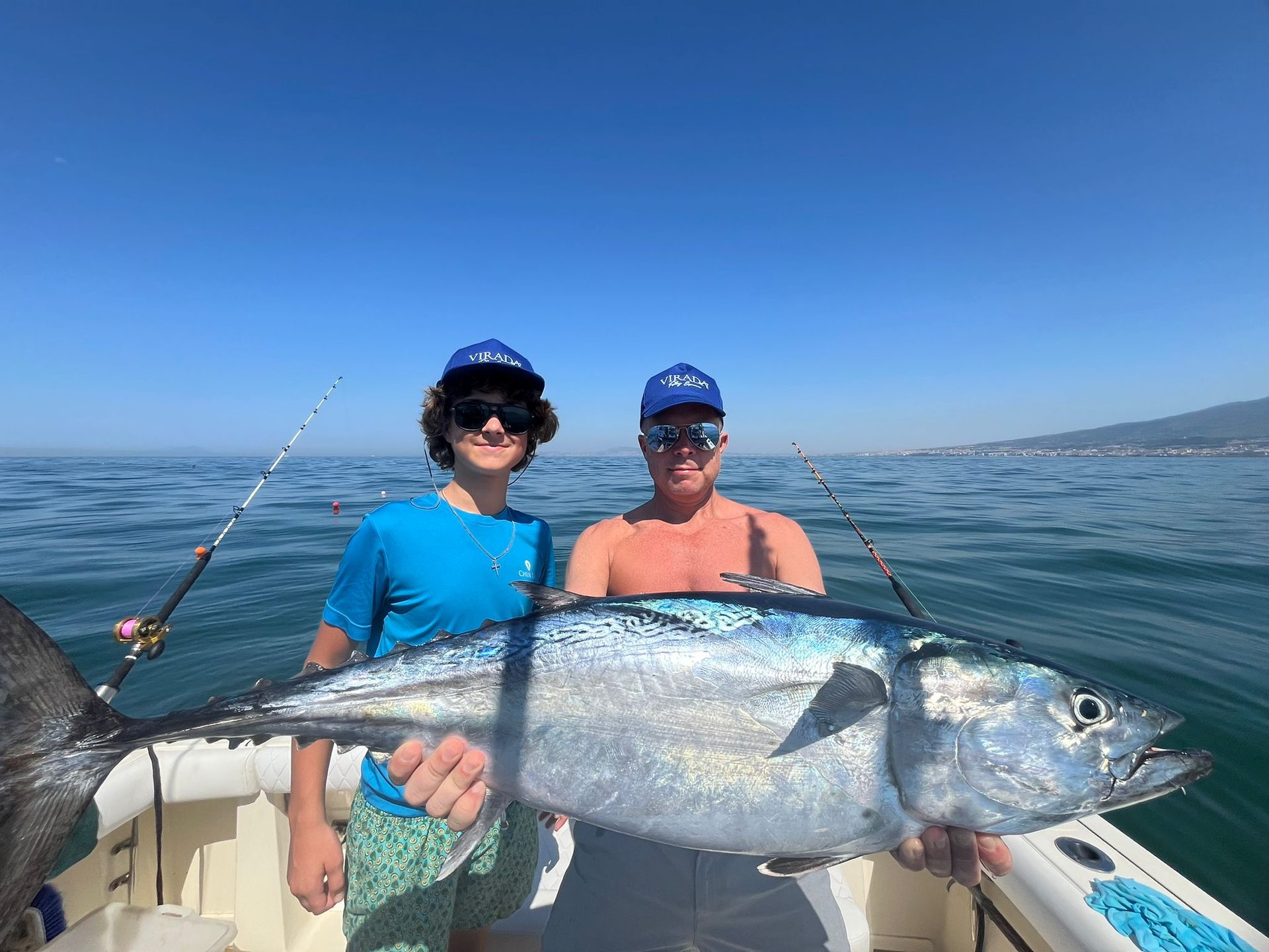 Father and son with a tuna catch, Virada Fishing Experience